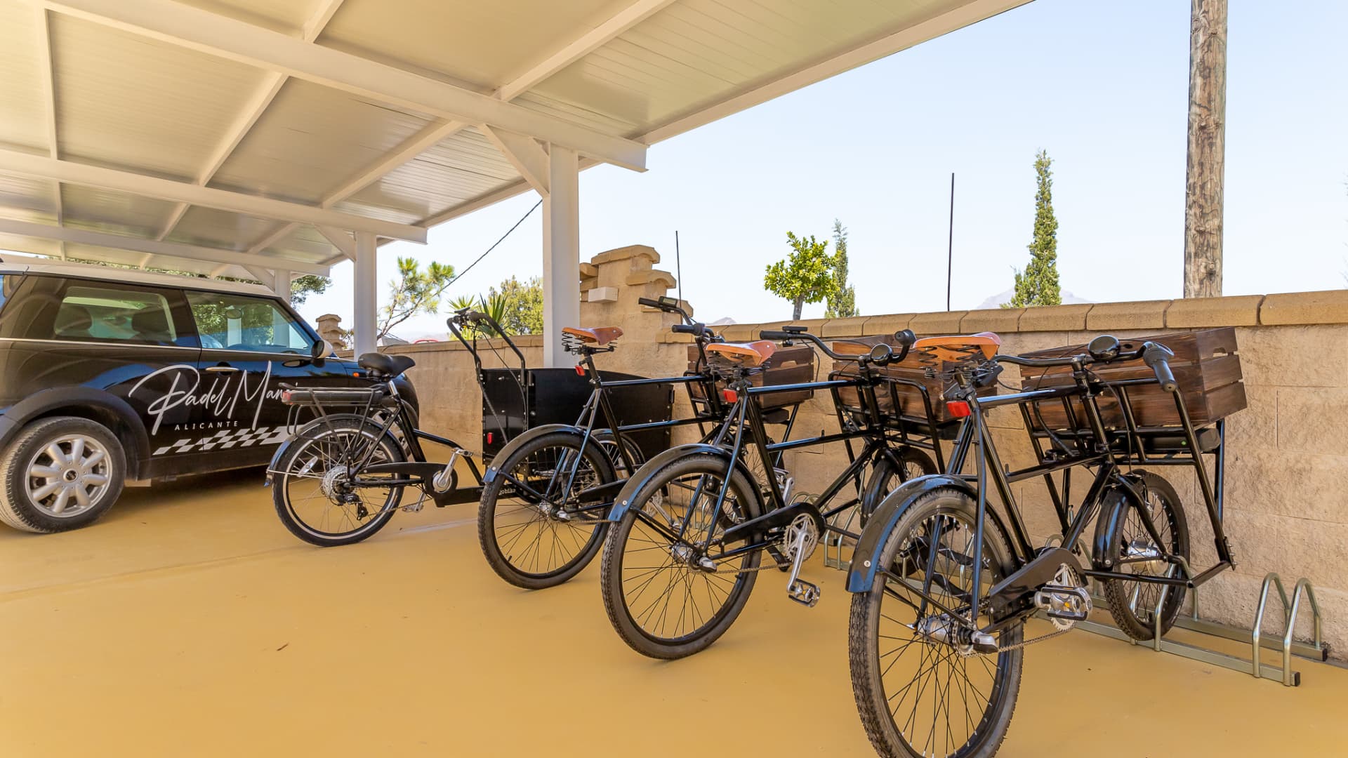 Branded estate bicycles and electric vehicles in the carport