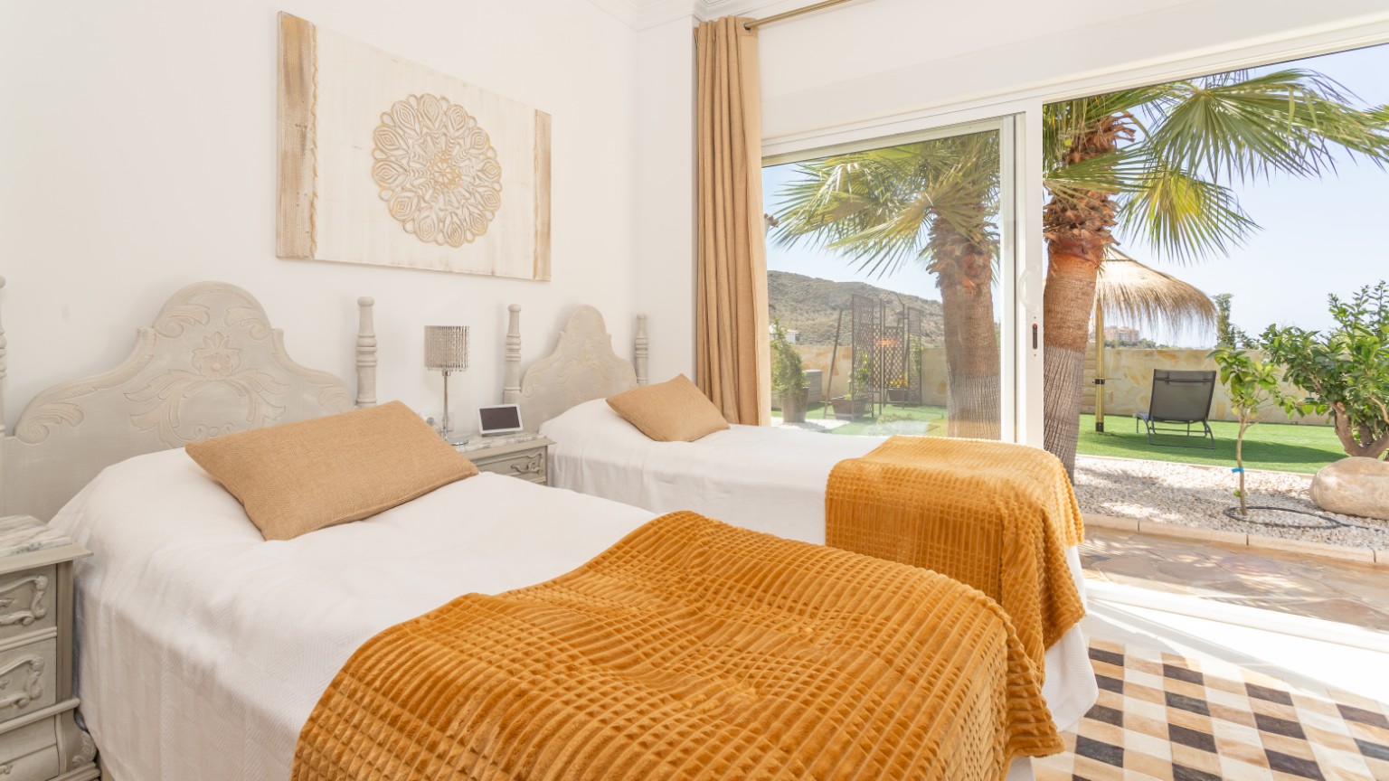A twin bedroom opening onto the terrace